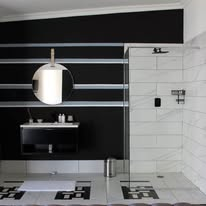 Modern walk-in shower with monochrome tiling